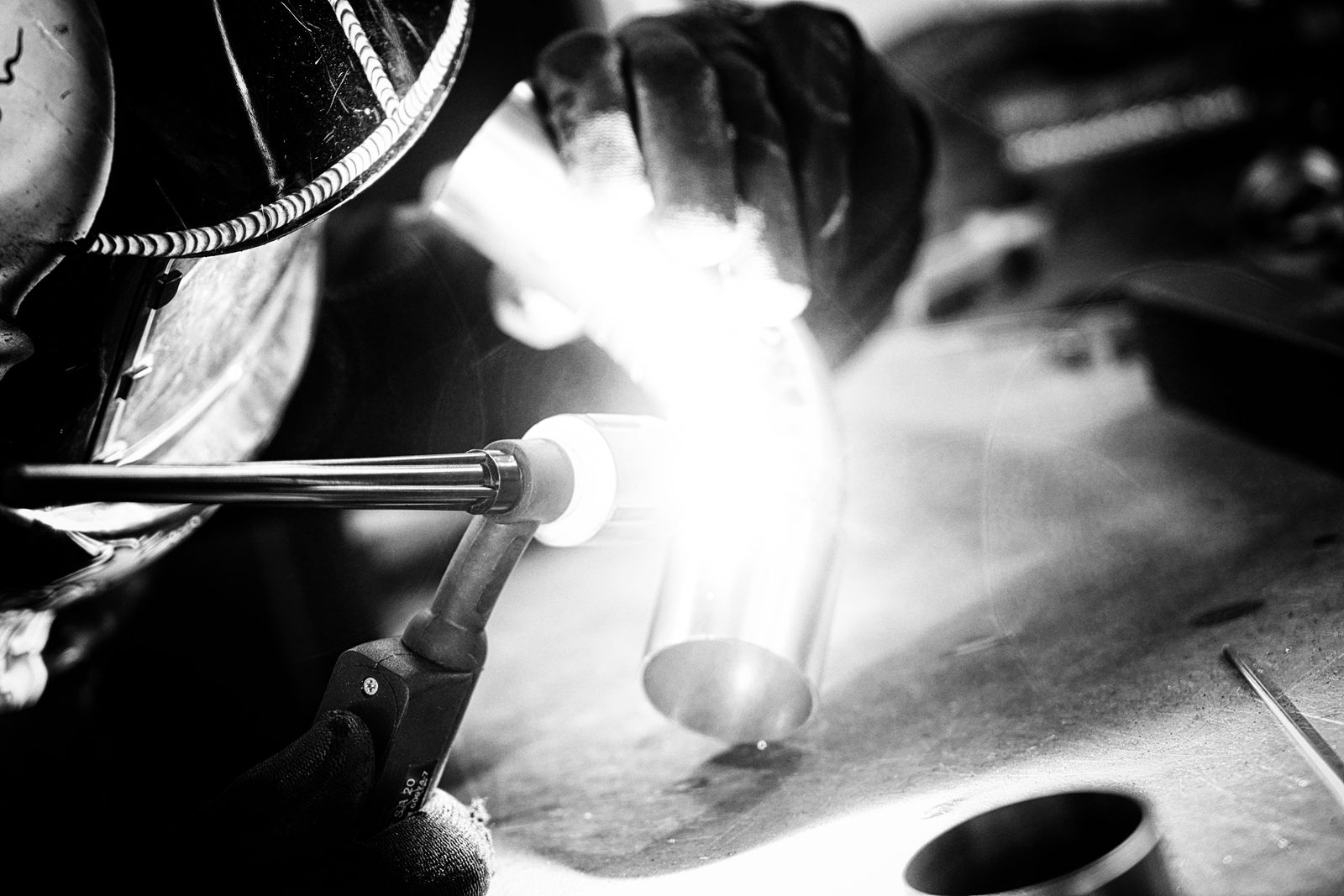 Exhaust Revolution — Sparks from the weld.