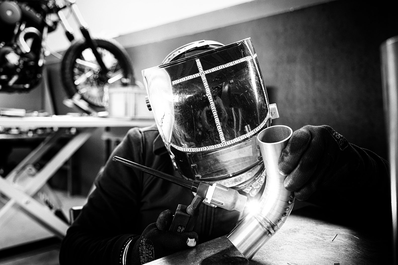 Exhaust Revolution — The welder at the bench.