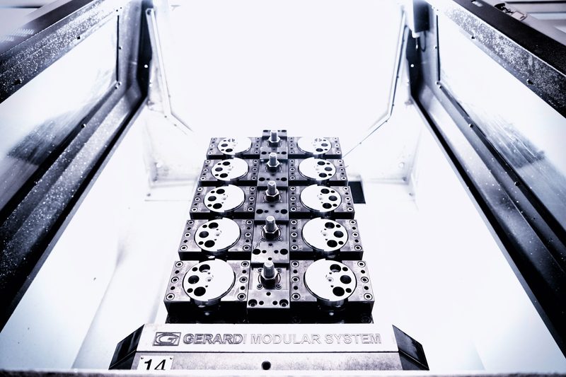 IAMETECH, the workshop — A pallet with discs being machined, from above.