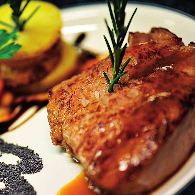 A meat main course with rosemary