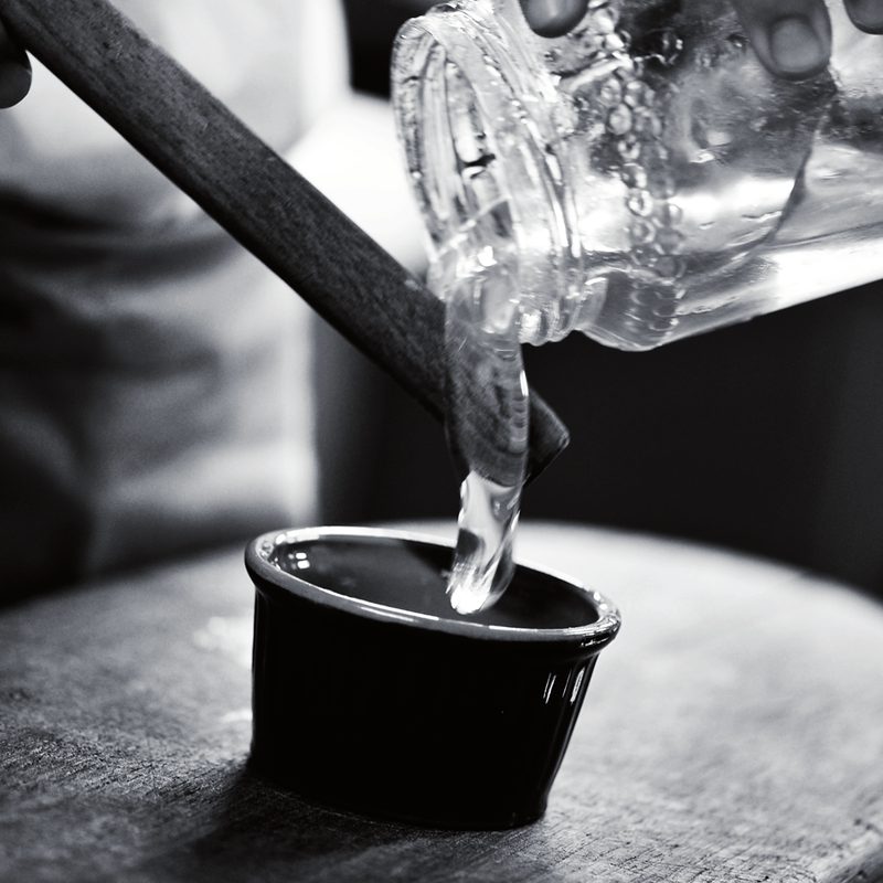 Oil being poured, in black and white