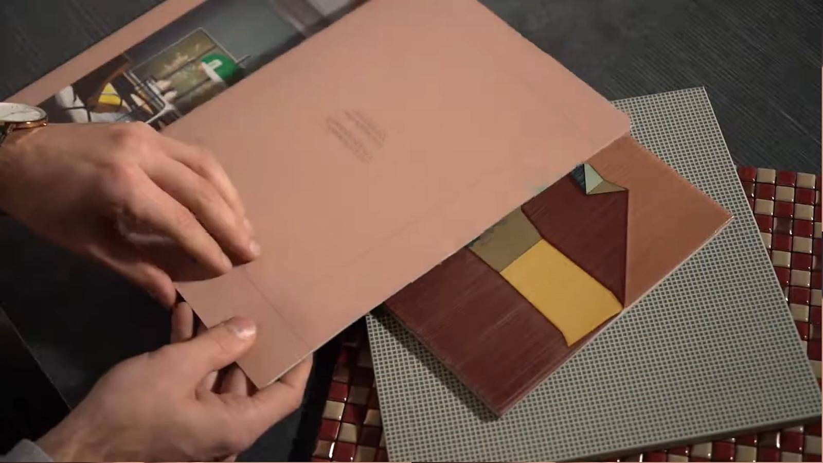 Ceramica Bardelli — The material up close: samples, mosaics and catalogues leafed through by hand.