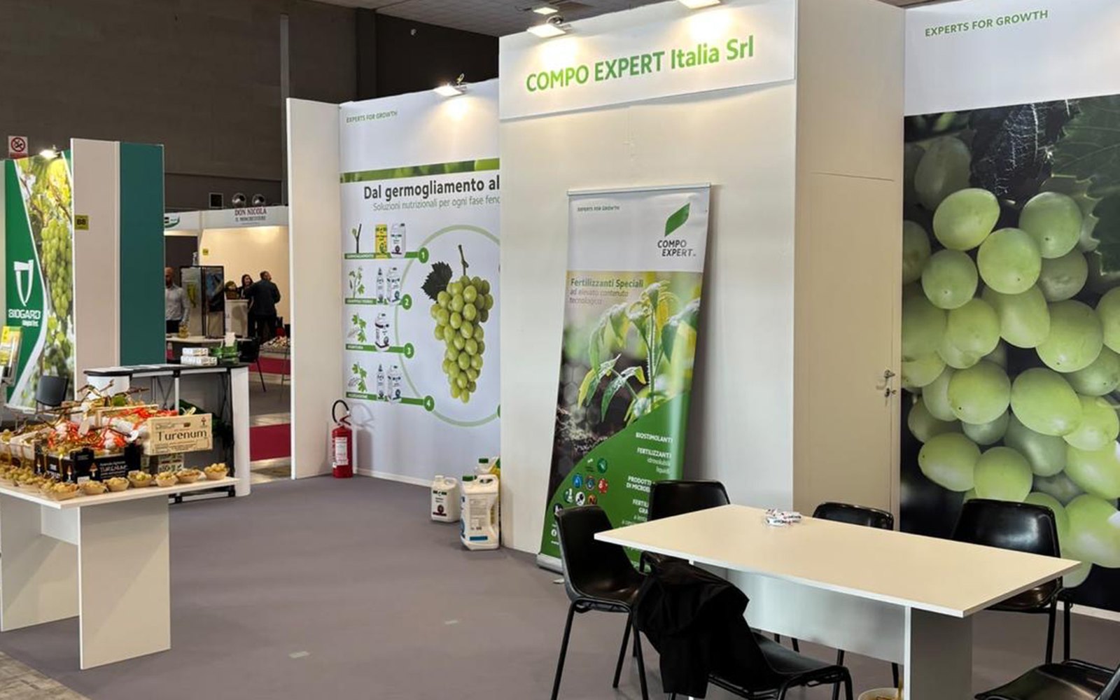 COMPO EXPERT — LUV 2026 stand — The side of the stand with the COMPO EXPERT Italia Srl sign and the roll-up banner.