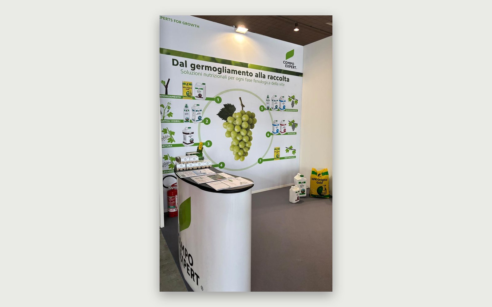 COMPO EXPERT — LUV 2026 stand — The central wall and the counter during the fair.