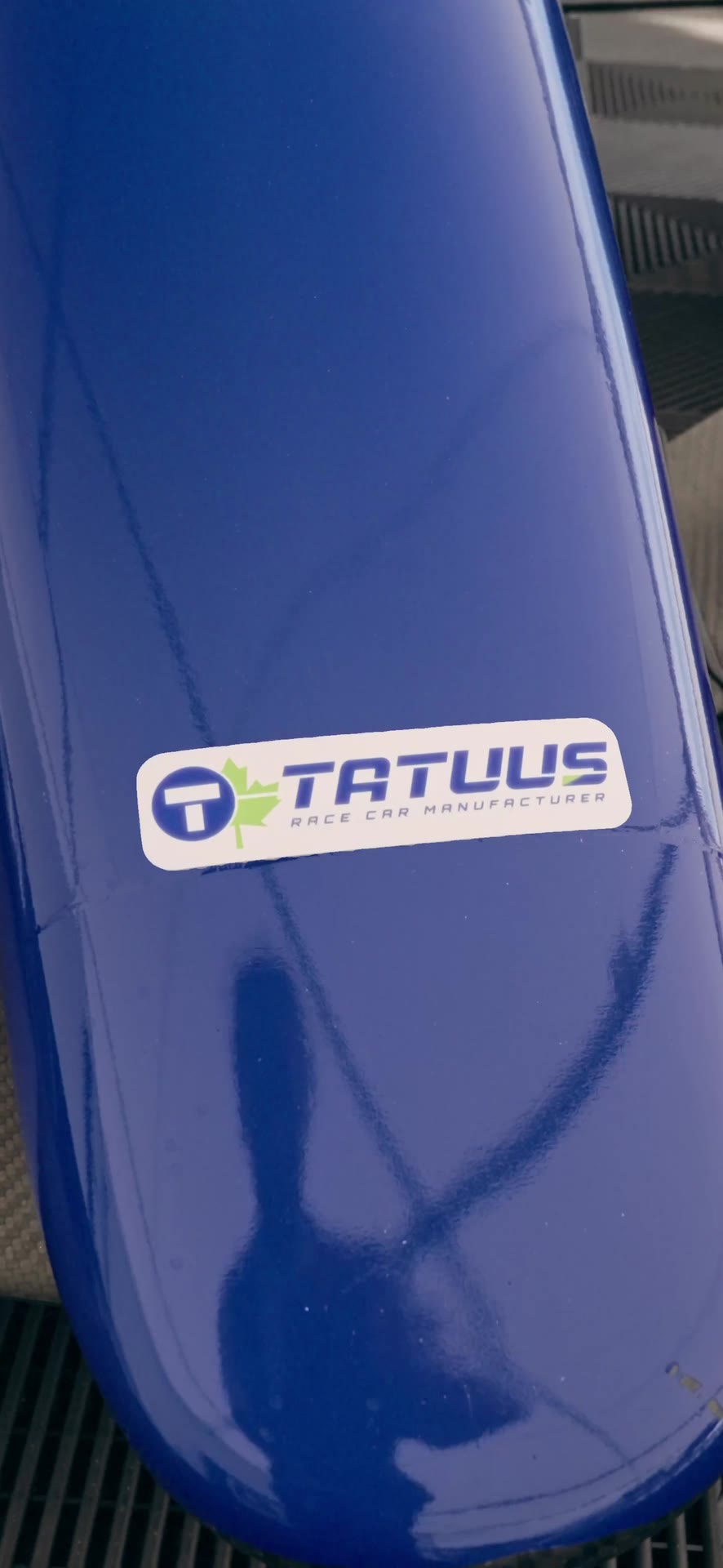 Tatuus — The Tatuus logo on the nose.